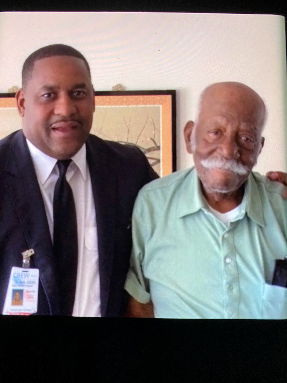 David Grey standing beside his father